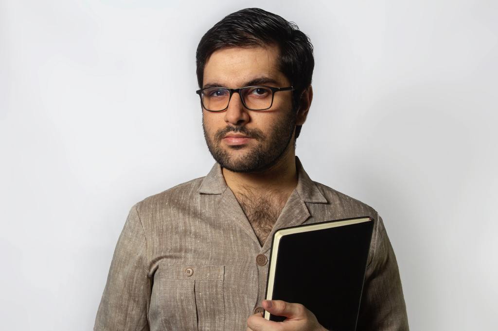 Image of a man with glasses.